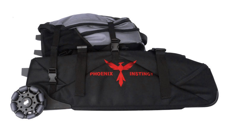 Photo of a 'Phoenix Instinct Bag' Twin set consisting of a grey rucksack and a black wheeled luggage bag, with the words 'Phoenix Instinct' emblazoned in orange text on the side of the luggage bag, with a stylized image of a phoenix in between the two words. Clip straps allow the rucksack to be connected to the luggage bag to make it easier to transport both bags together.
