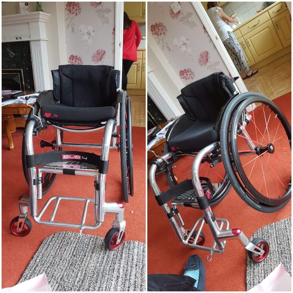 Two photos of a 'RGK Sub 4 Tiga'- A profile photo on the left, and a three quarter side profile photo on the right. Both photos highlight unique features of the self-propelling wheelchair: the profile photo shows the lightweight aluminium frame, including the unusual fixed in place footrest; while the side profile photo focuses more on the way the minimalist frame connects the main wheels, & castors all onto the same central frame in order to minimize weight.