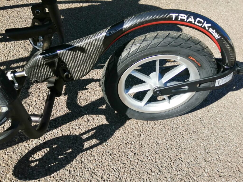 Side profile photo of a 'Rehasense Track Wheel' wheelchair attachment.