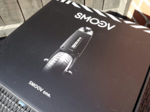 Photo of the packaging for a 'SMOOV One' power add-on for a mobility aid.