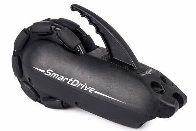 Image of a 'SmartDrive' power add-on rear wheel for a wheelchair.