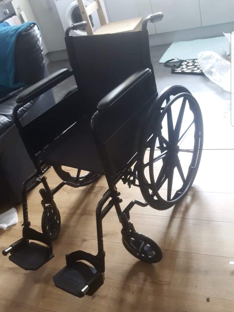 Three quarter profile photo of a 'Drive Folding Wheelchair' self-propelling wheelchair.