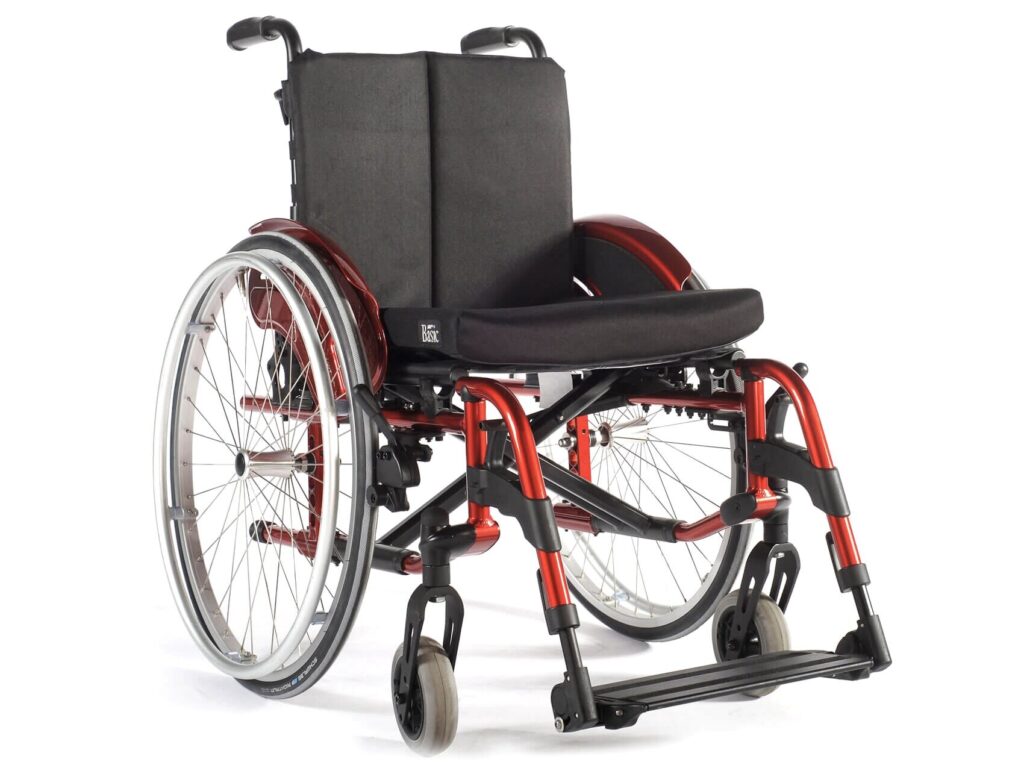 Profile image of a metallic orange 'Quickie Helix' self-propelling wheelchair.