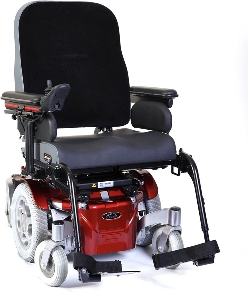 Three quarter profile image of a 'Quickie Salsa' electric wheelchair. The base of the wheelchair is in a dark metallic orange colour.